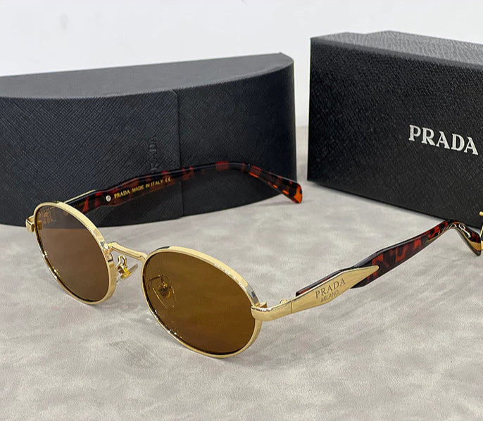 🕶️ Lentes Prada Ovalados – Lujo, Estilo y Protección Total